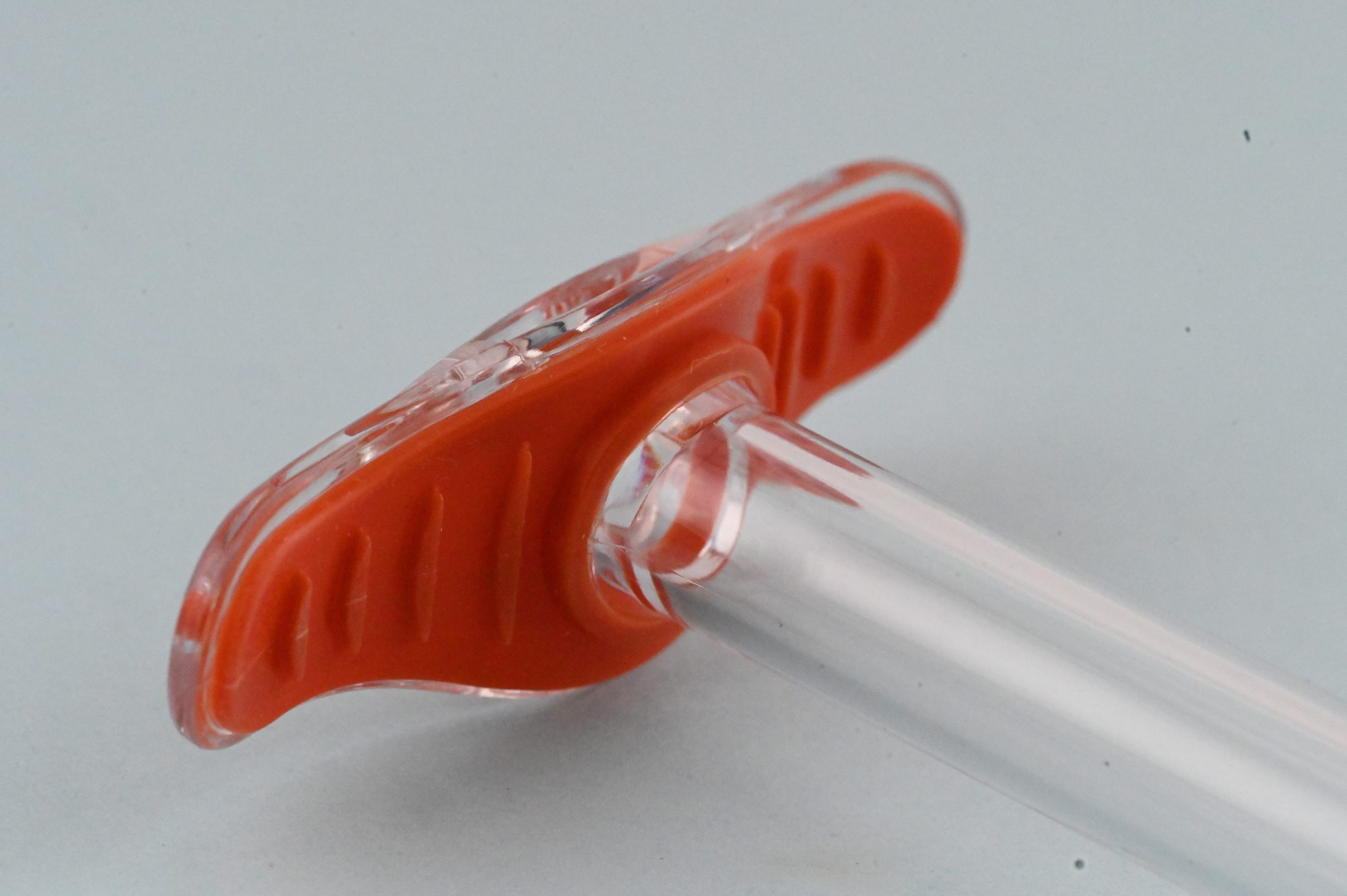 An assembled valve for fluidic systems, reinforced with metal overmolds.